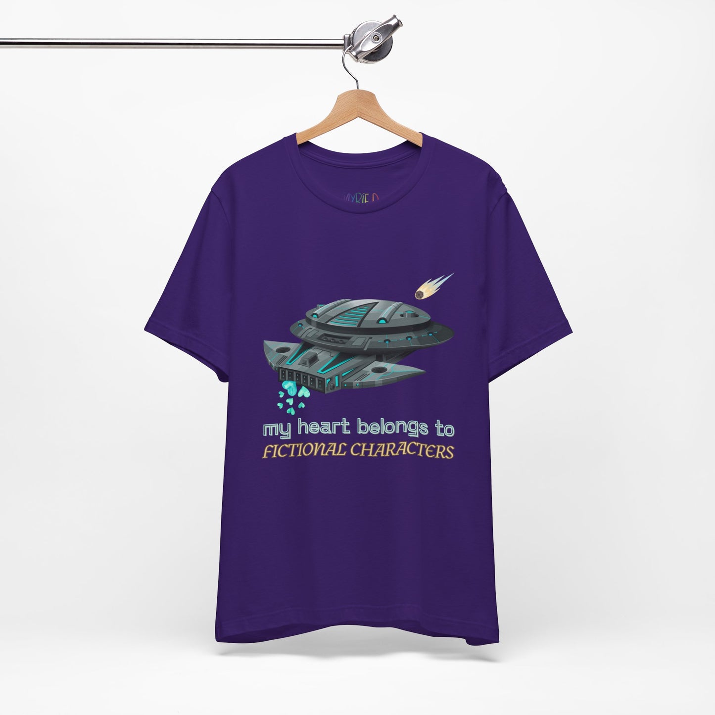 Purple t-shirt with a spaceship and text 'My Heart Belongs To Fictional Characters'