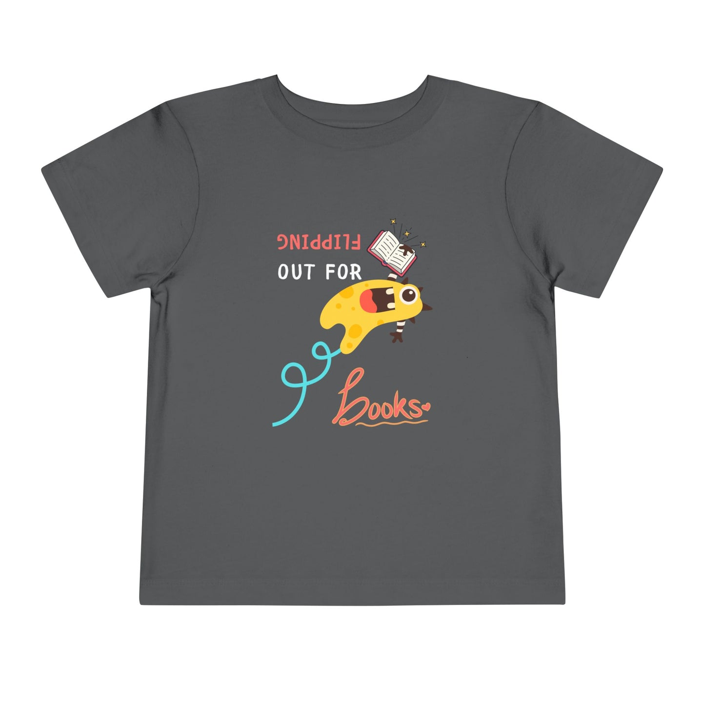 Gray toddler t-shirt with a yellow monster flipping backwards through the air while holding a book and playful text "FLIPPING OUT FOR BOOKS'