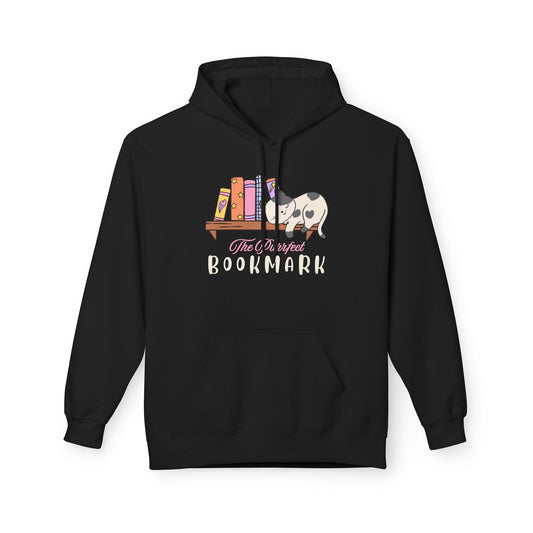 Black hoodie with an illustration of a white and gray cat resting beside a colorful bookshelf, featuring the text “The Purrfect Bookmark.”