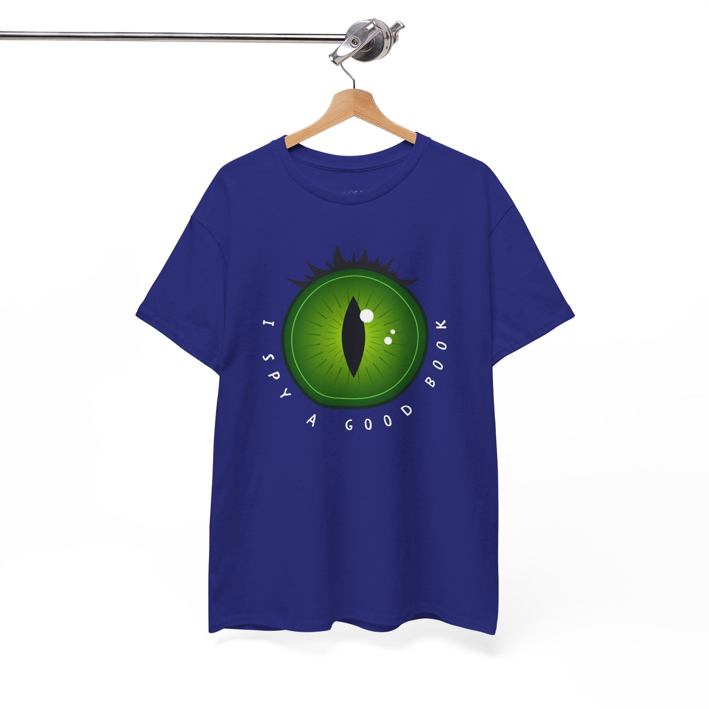 Blue t-shirt with a green eye design and text 'I Spy A Good Book' on a hanger against a white background