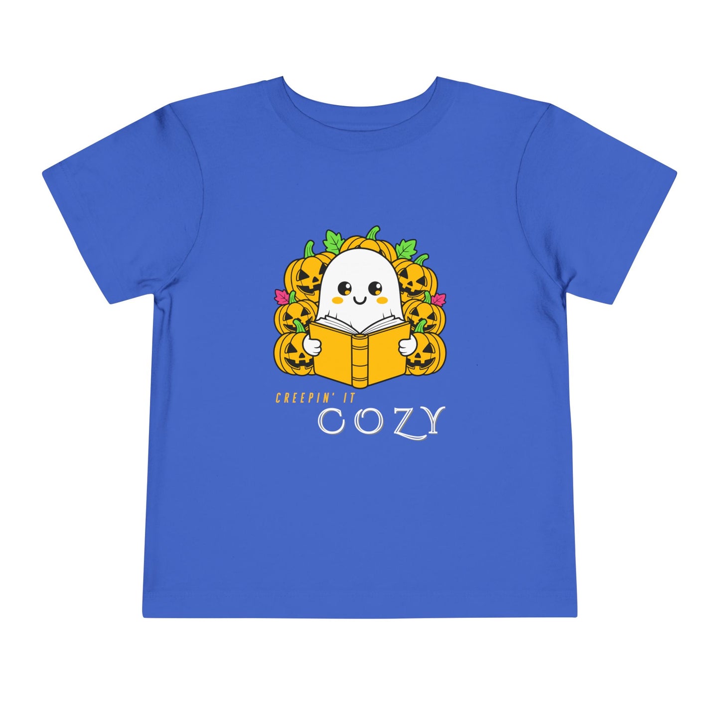 Blue toddler t-shirt with a ghost reading a book in pumpkin patch and text 'Creepin' It Cozy'