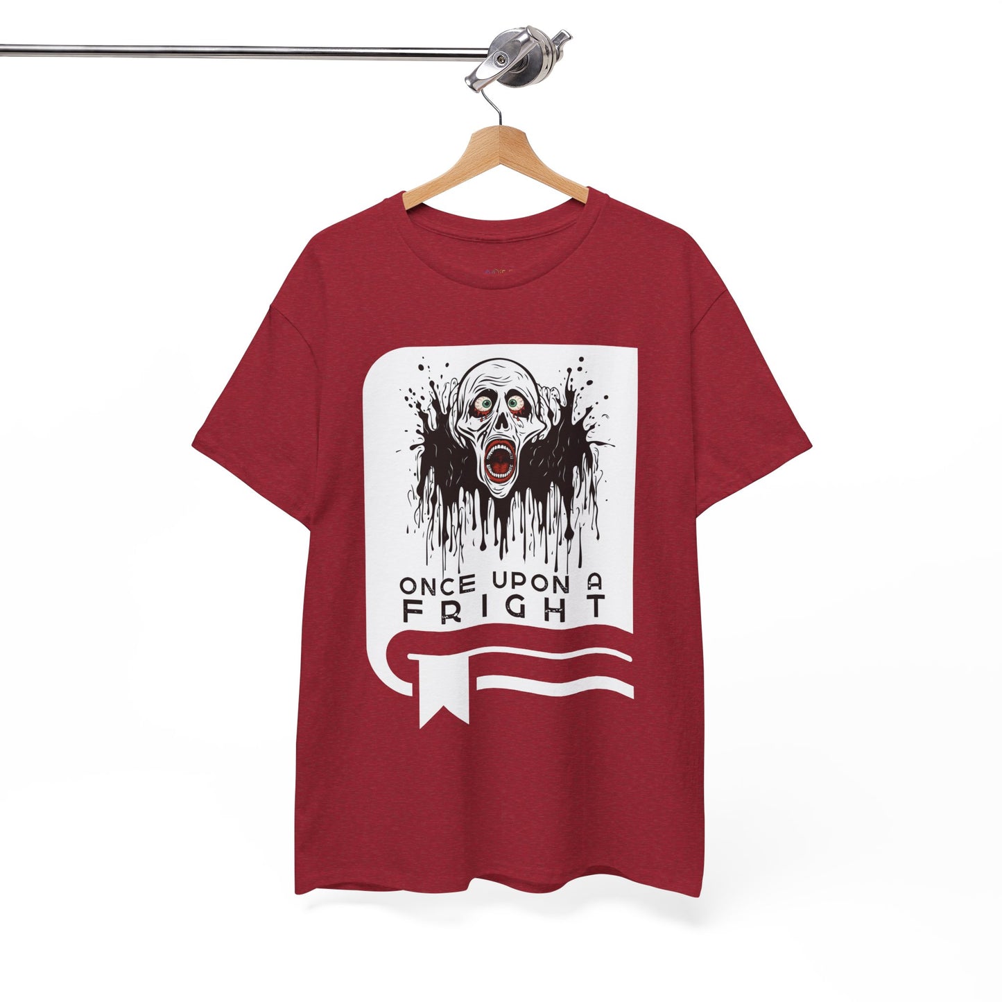 Red t-shirt with a graphic design of creepy skeleton graphic on a book cover and text 'Once Upon a Fright' on a hanger against a white background.