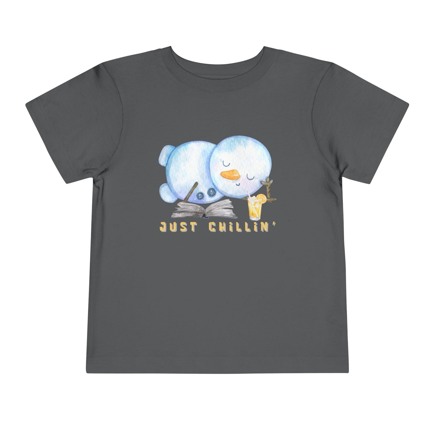 Gray toddler t-shirt with a snowman laying down with a good book and cold drink, 'Just Chillin' text on a white background