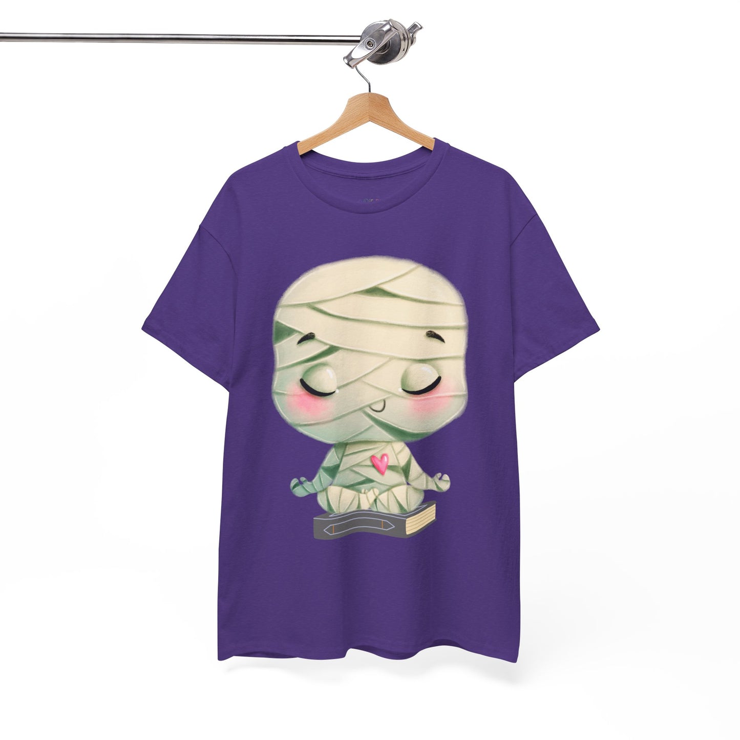 Purple t-shirt with a cartoon mummy in a meditation pose, sitting on a book