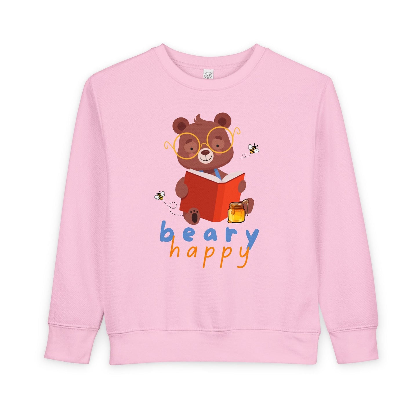 Pink toddler sweatshirt with a bear wearing large yellow glasses and reading a book with a smackrel of honey nearby for a snack and text 'beary happy' on a white background