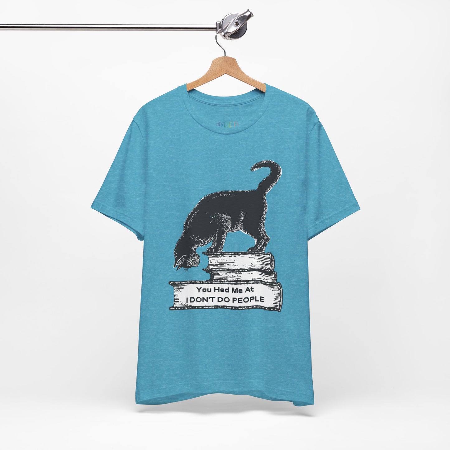 Blue t-shirt with a graphic design of a cat on a stack of books and text 'You Had Me At I Don't Do People'