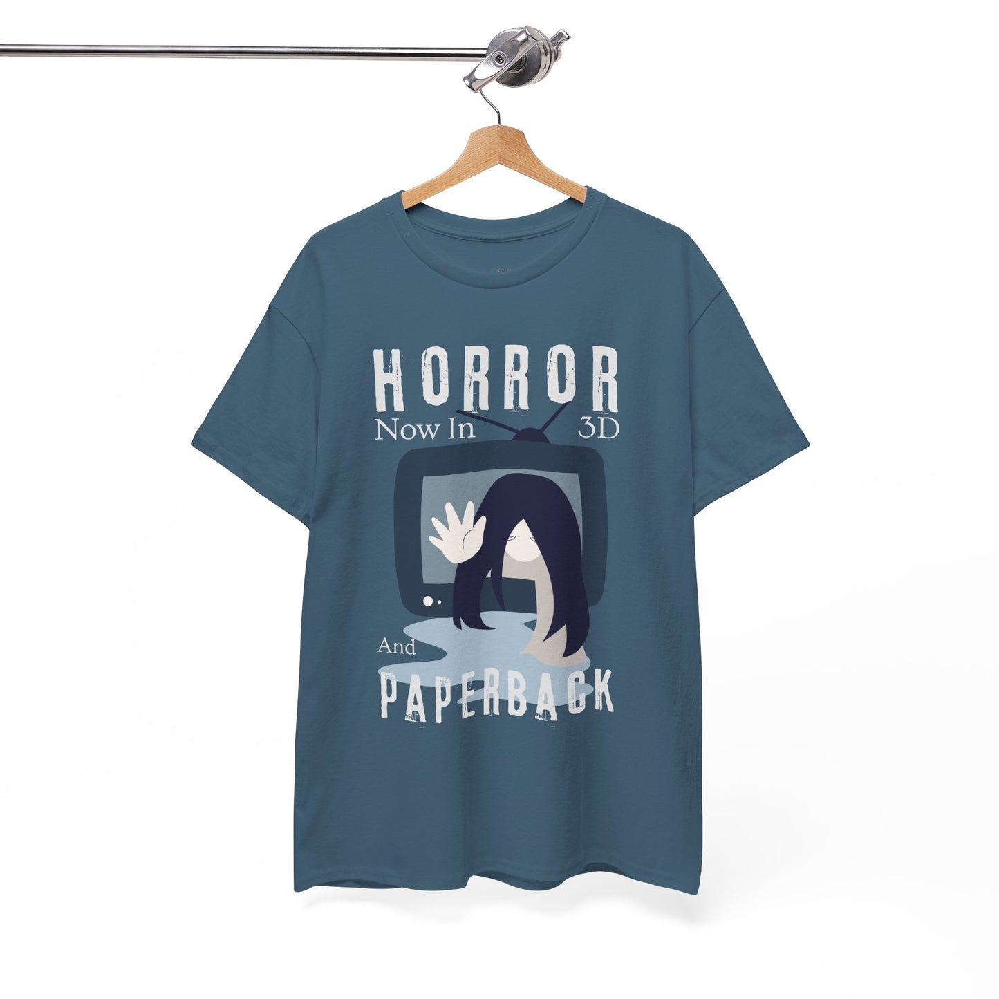 Blue t-shirt with horror-themed Ring graphic and text 'Horror Now in 3D And Paperback' on a hanger against a white background