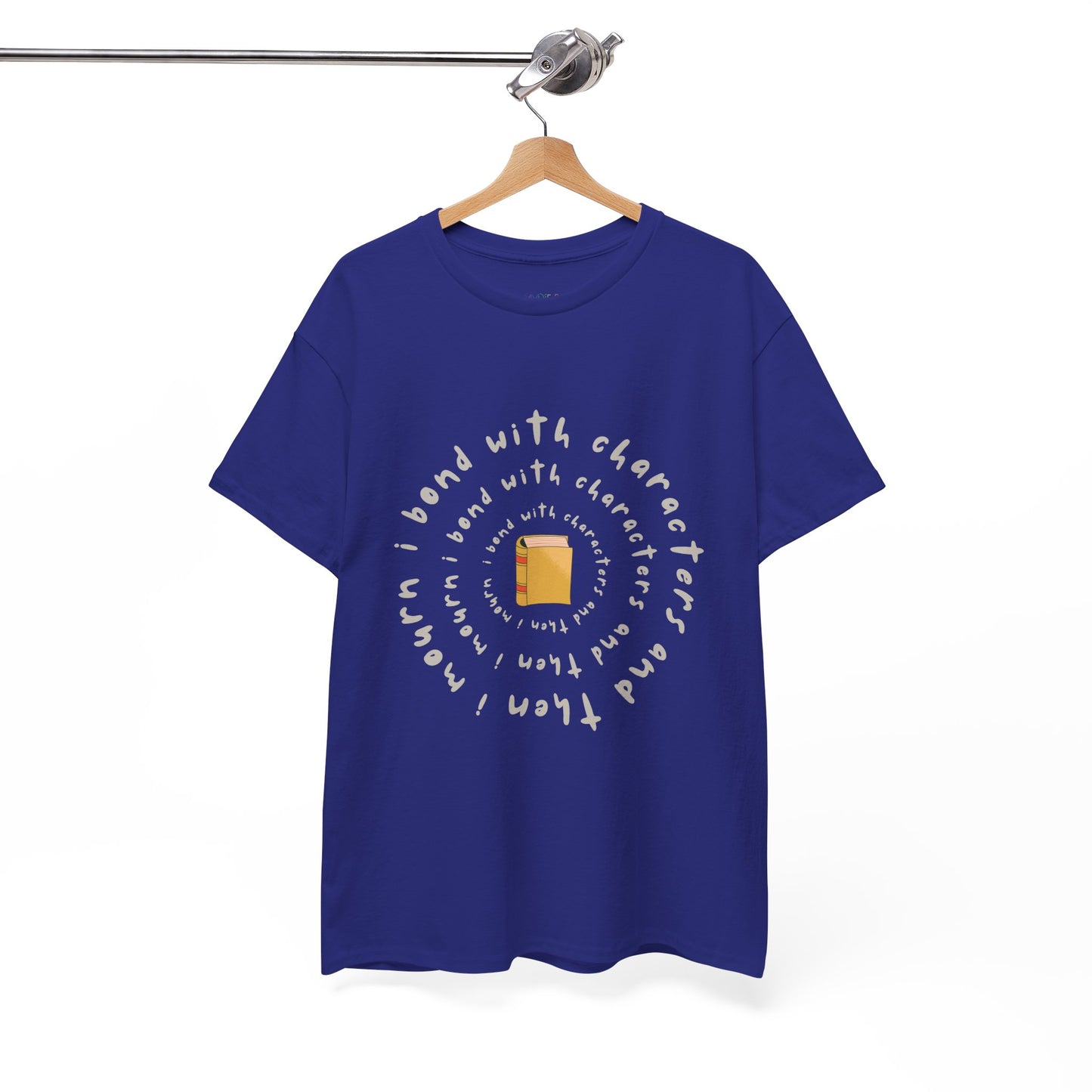 Blue t-shirt with a small book at the center and layered spiral text 'I Bond With Characters & Then I Mourn'