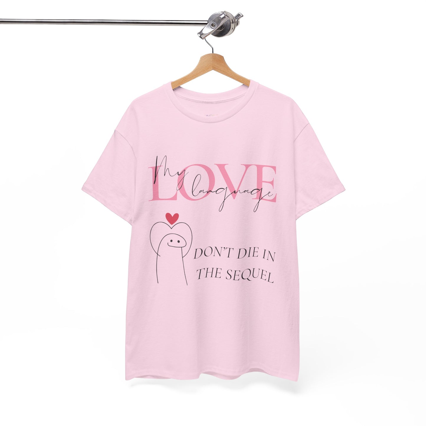 Pink t-shirt with a white figure holding a heart up, pink and white text, 'My Love Language, Don't Die In The Sequel'