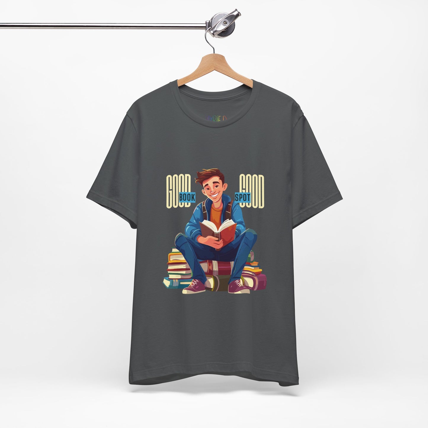 Gray t-shirt with a graphic of a boy holding a book while sitting on a stack of books and text 'Good Book, Good Spot'