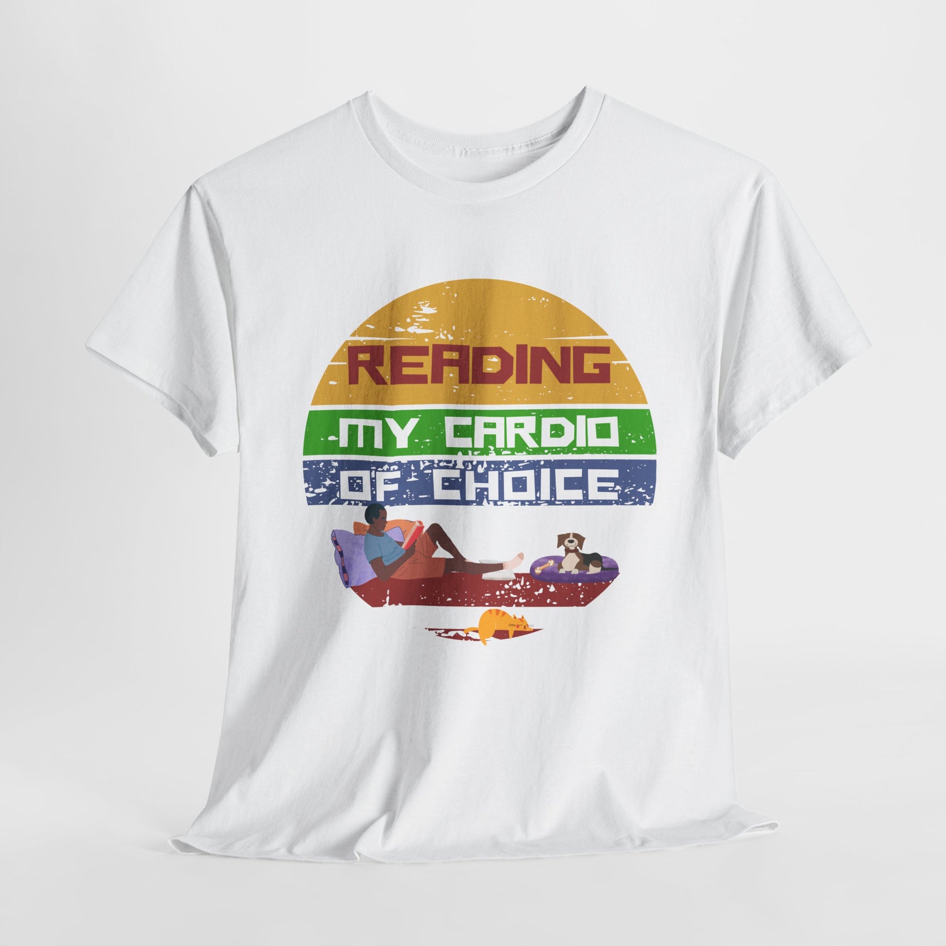 White t-shirt with a retro background, a man lounging with a book, surrounded by his dog and cat, text 'Reading is my cardio of choice'