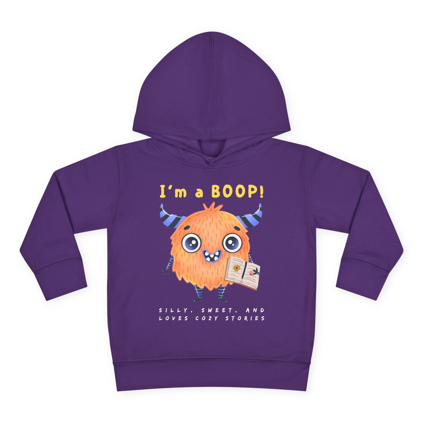 Yellow cartoon monster with big eyes and a sweet smile, holding a book with the words “I’m a Boop” above — printed on a cozy toddler hoodie.
