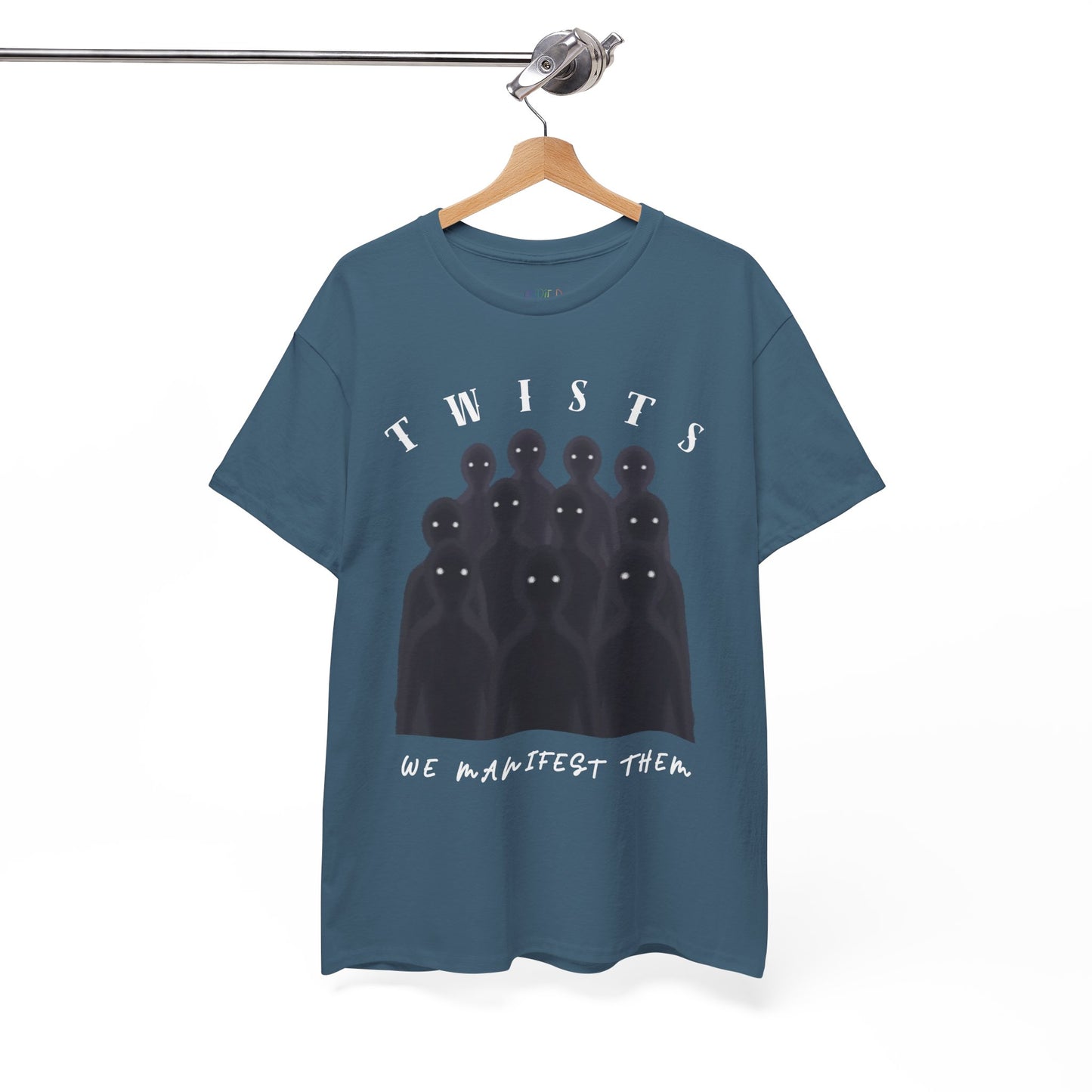 Blue t-shirt with a crowd of sinister black shadows and text 'TWISTS, We Manifest Them' on a hanger against a white background