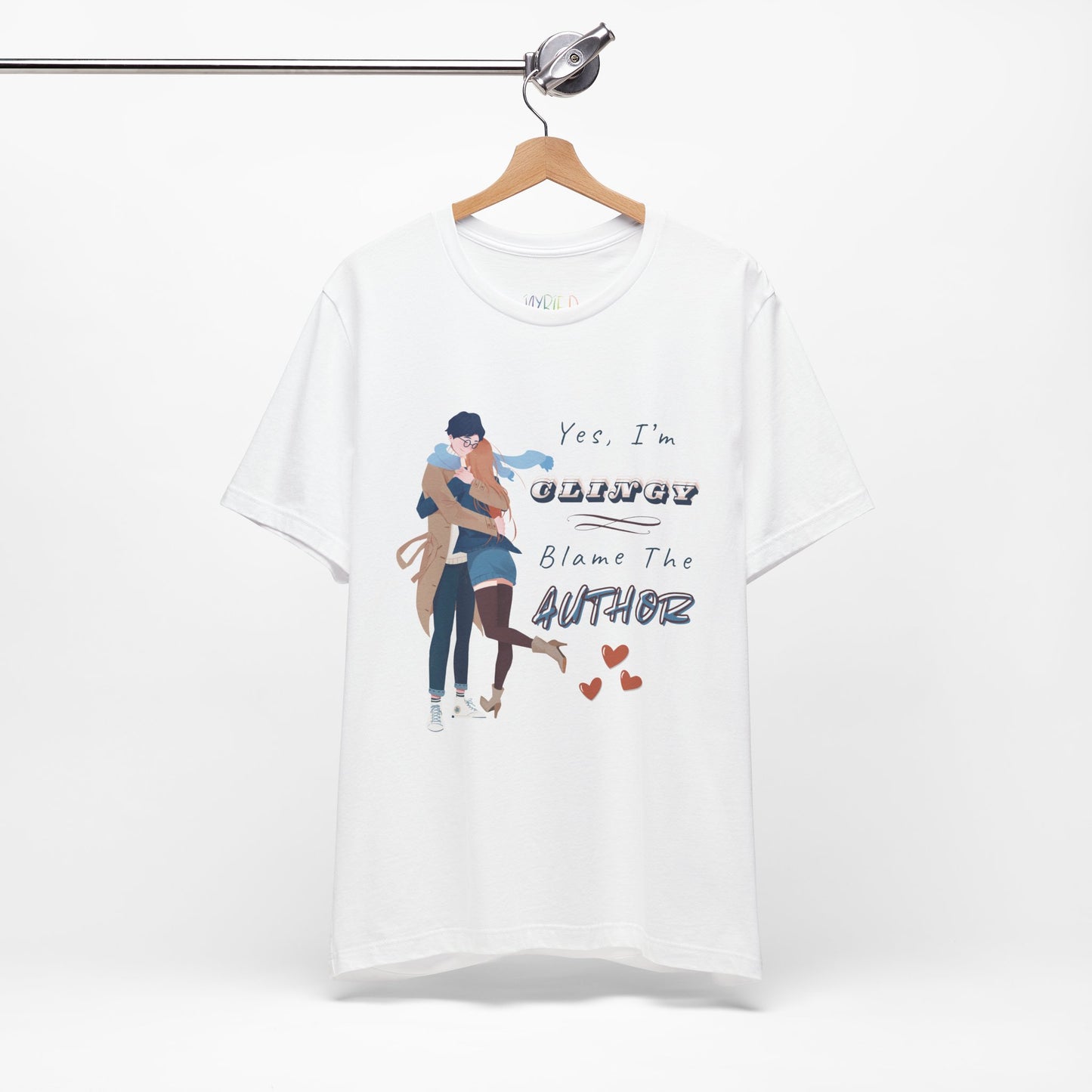White t-shirt with graphic design of a woman snuggled up to a man and text " and text on a white background 'Yes, I'm CLINGY. Blame The Author.'