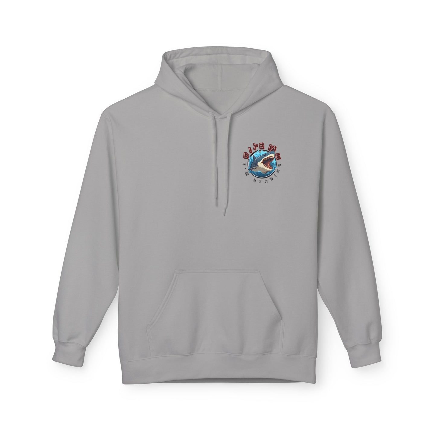 Light gray hoodie featuring a circular shark design with the text βBite Me, Iβm Readingβ in red and blue lettering.
