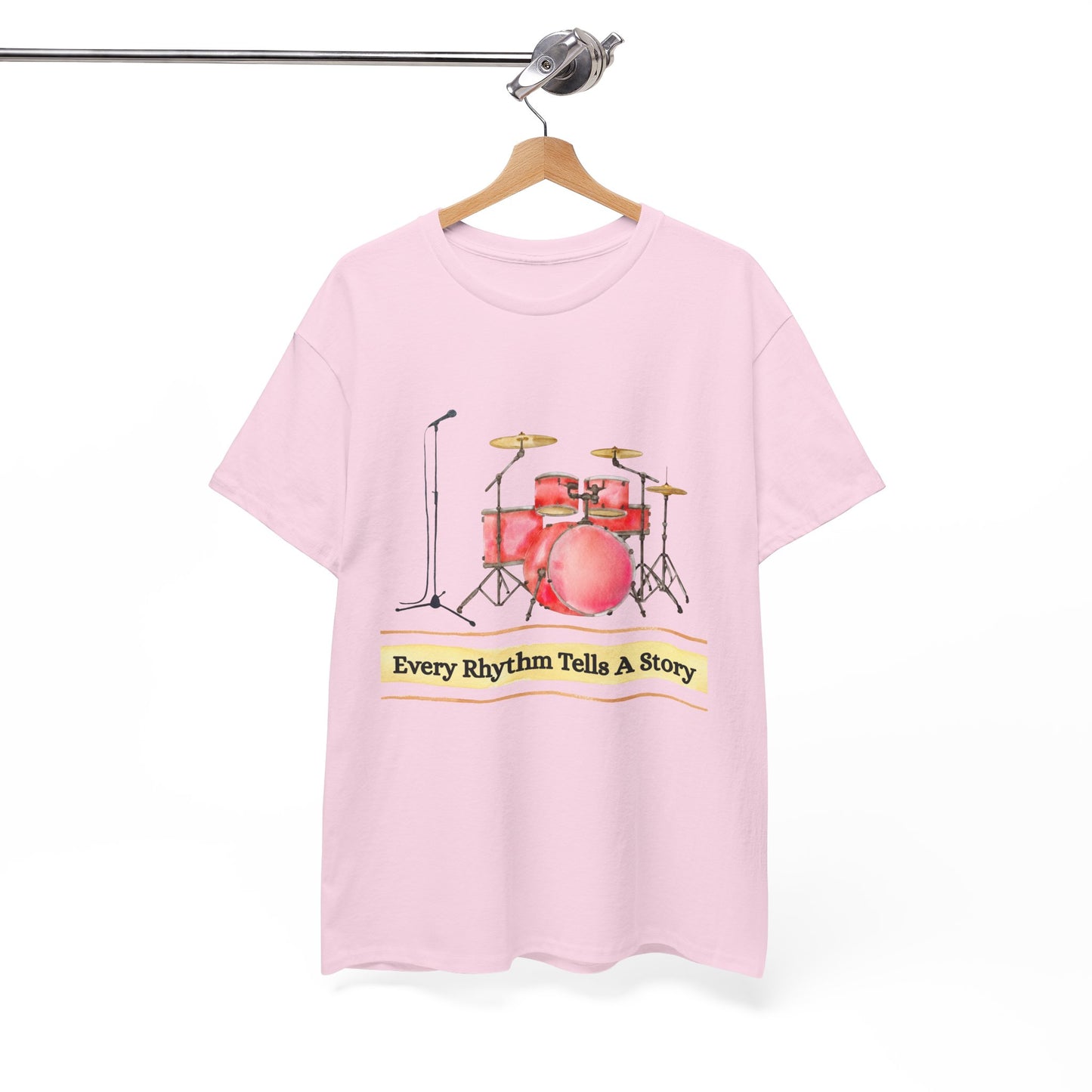 Pink t-shirt with drum set graphic, microphone and text 'Every Rhythm Tells A Story'
