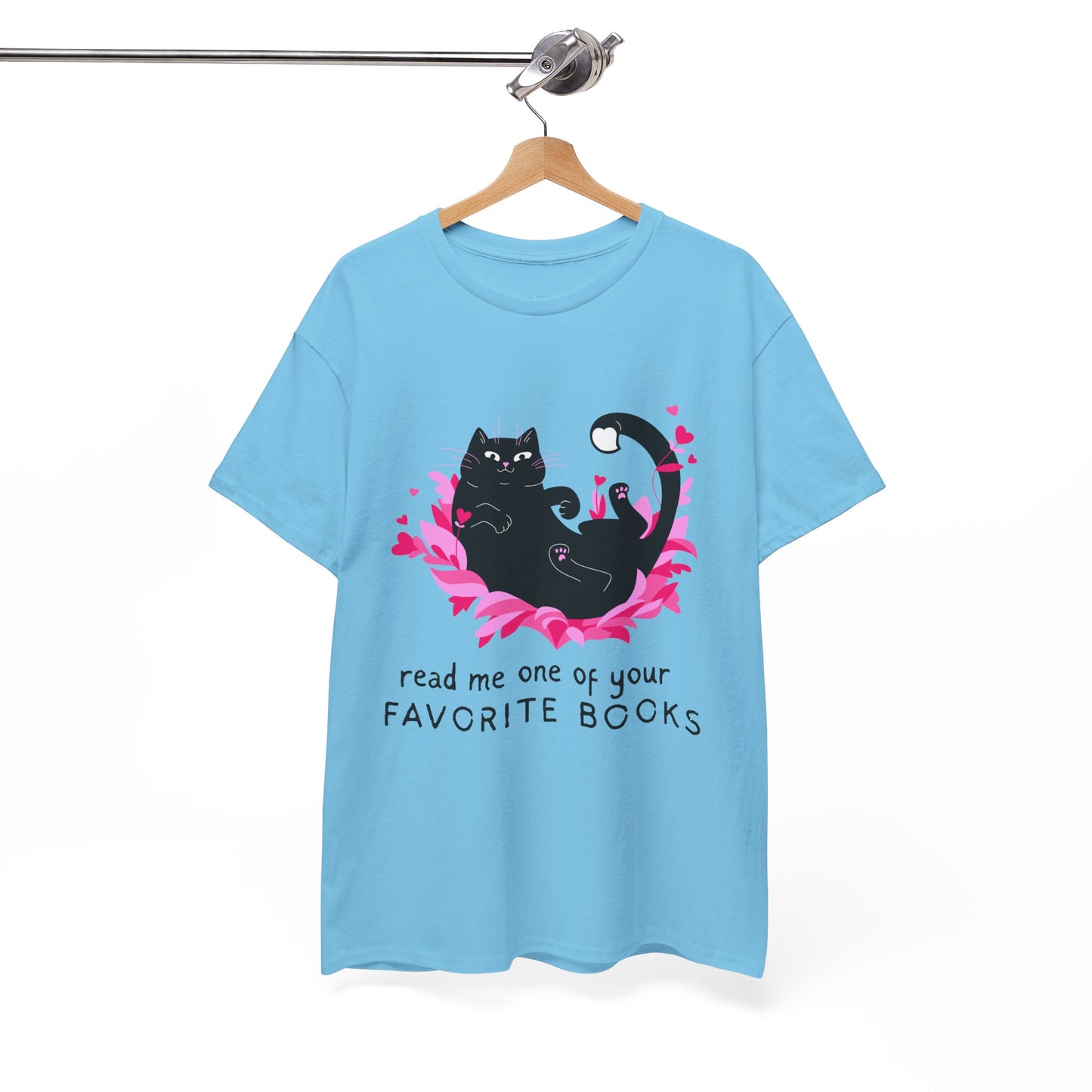 Light blue t-shirt with a black cat laying in a pile of pedals and roses, text 'read me one of your favorite books'