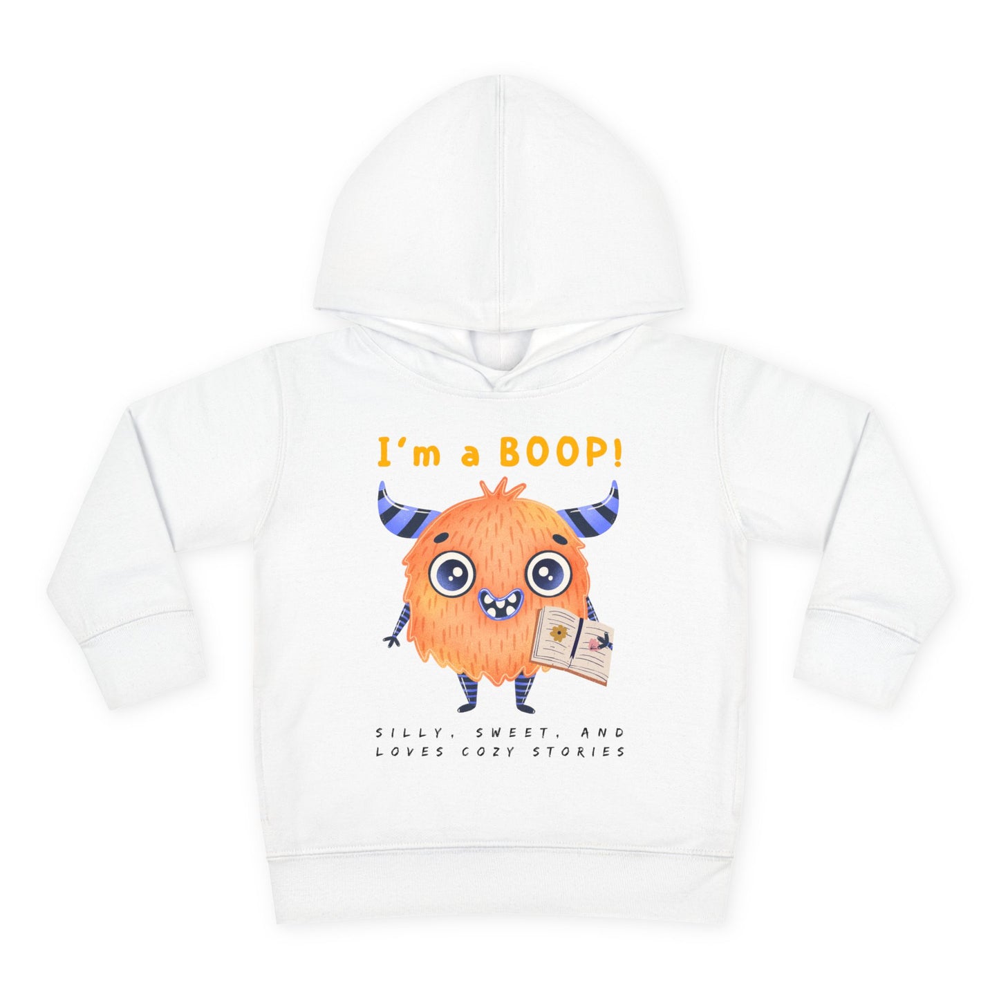 White toddler hoodie with a cartoon monster holding a book and text 'I'm a Boop', sub-text 'Silly, Sweet, And Loves Cozy Stories' on white background