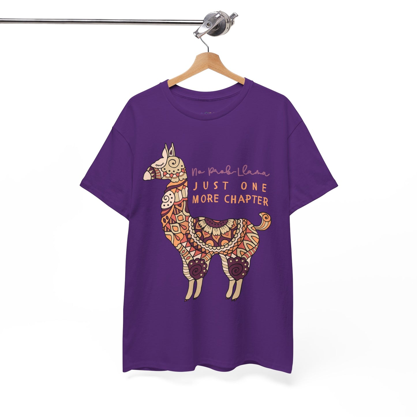 Purple t-shirt with a decorative llama graphic and text 'No Prob Llama, Just One More Chapter'