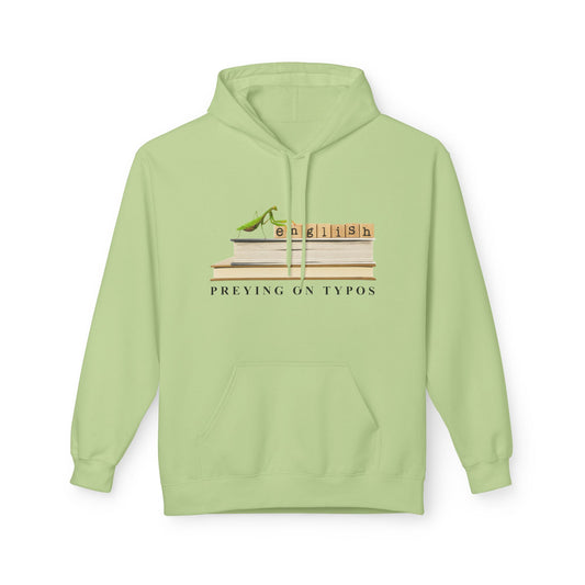 Light green hoodie featuring stacked books with Scrabble-style tiles spelling “English” and a green praying mantis perched on top. Text below reads “Preying on Typos.”
