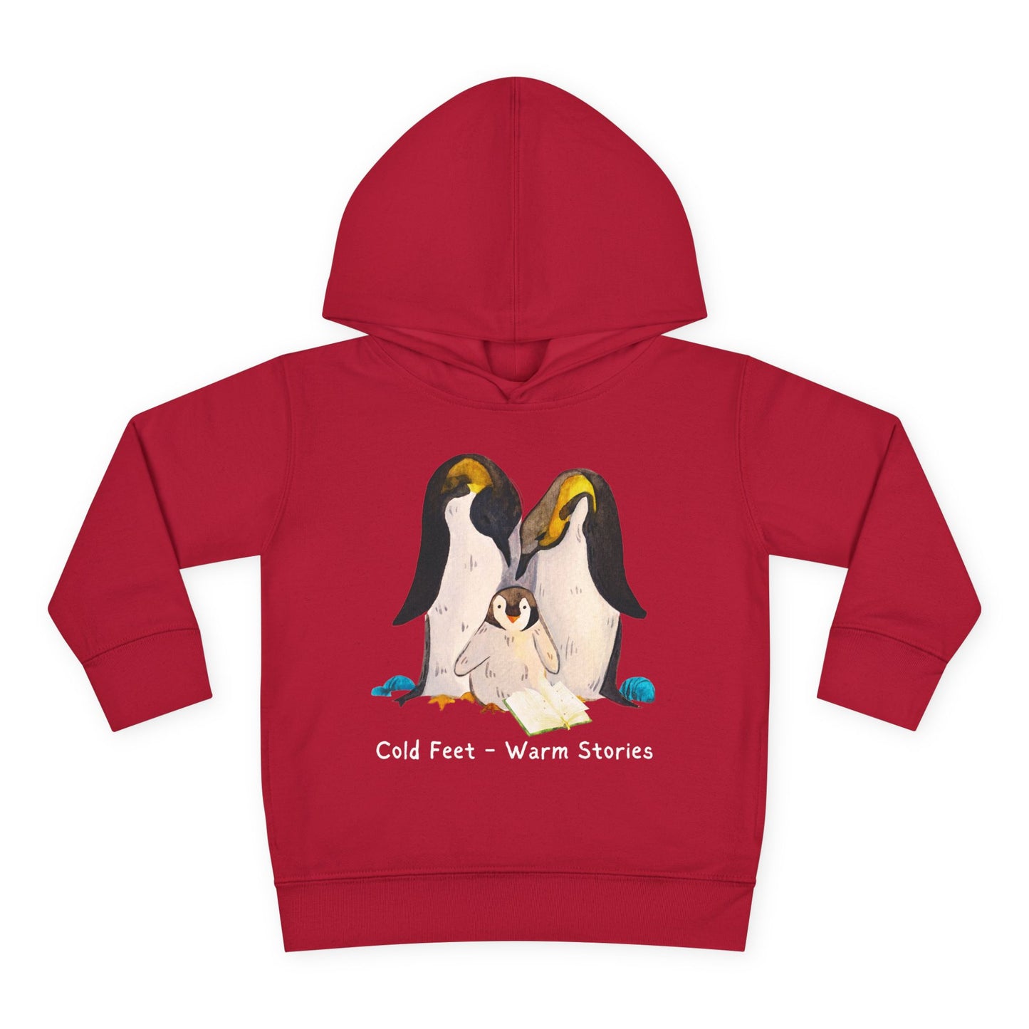 Cartoon penguin family huddled together reading an open book with the words “Cold Feet • Warm Stories” above — printed on a cozy toddler hoodie.