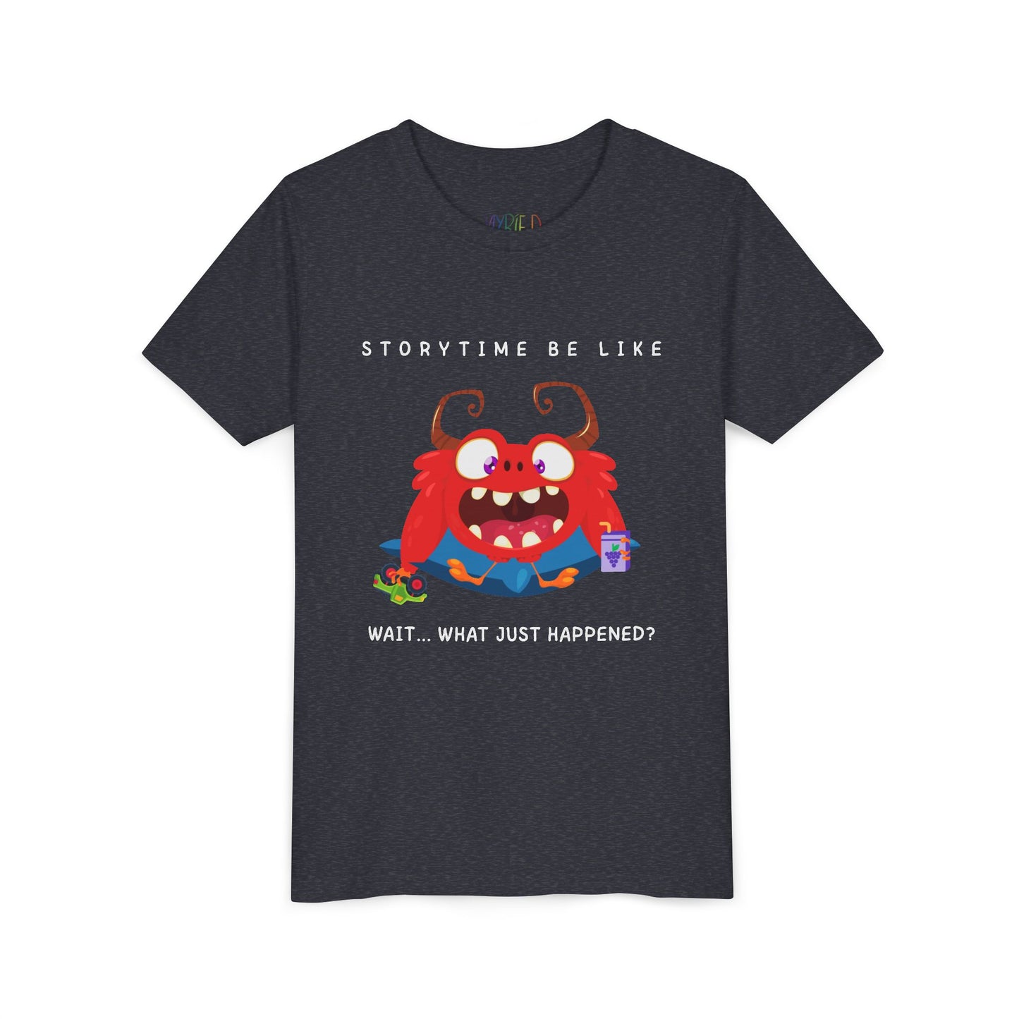 Heather navy t-shirt with a bewildered cartoon monster graphic sitting on a pillow, holding a car toy and a juice box, text 'Storytime be like wait...what just happened?'
