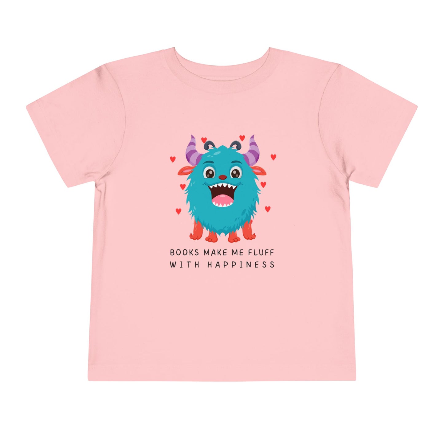 Pink toddler t-shirt with a fluffy blue monster graphic, floating hearts and text 'Books Make Me Fluff With Happiness' on a white background