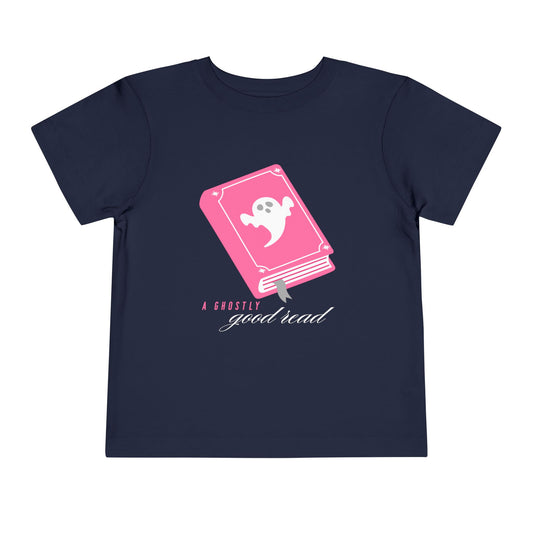 Navy blue t-shirt with a pink book and ghost graphic on the cover, pink and white text 'A ghostly good read'
