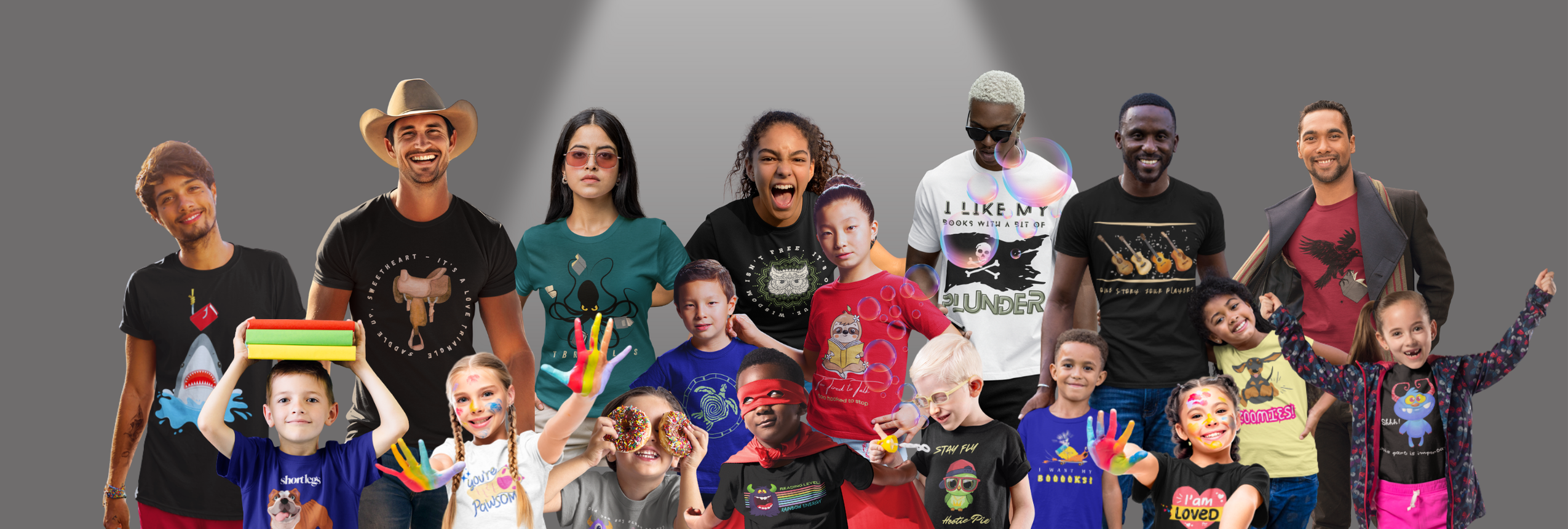 Group of people (various ages) wearing various t-shirts designs by Jaybie D., against a gray background.