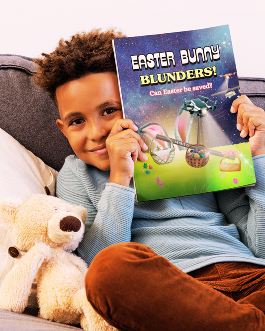 Boy sitting on the couch with his stuffed animal and the children's picture book Easter Bunny Blunders by Jaybie D.