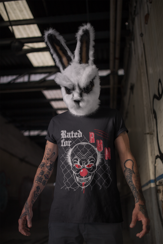 Image of a tattooed man is a dark hallway, wearing a scary bunny mask and a black t-shirt by Jaybie D. with an image of a clown and text 'Rated for RUN'