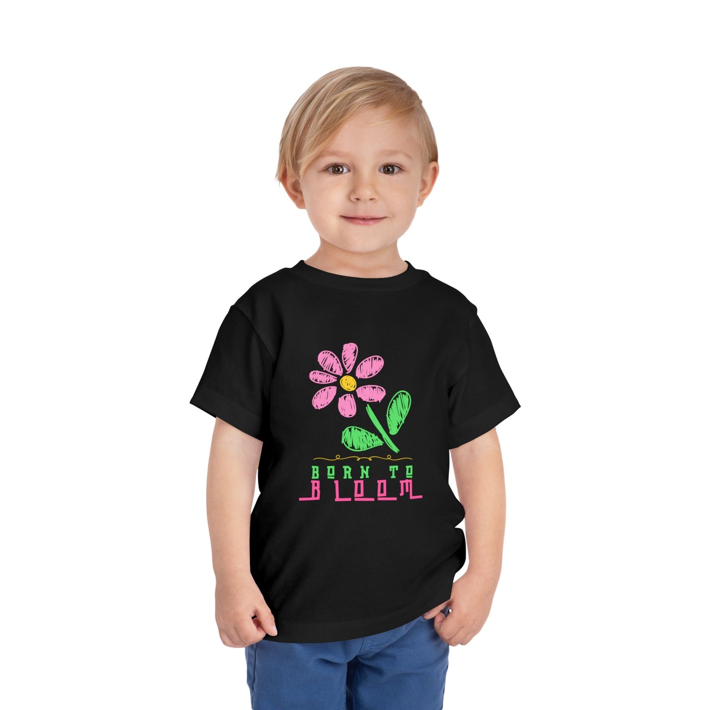 Toddler wearing a black t-shirt with a sketched pink flower and 'Born to Bloom' text 