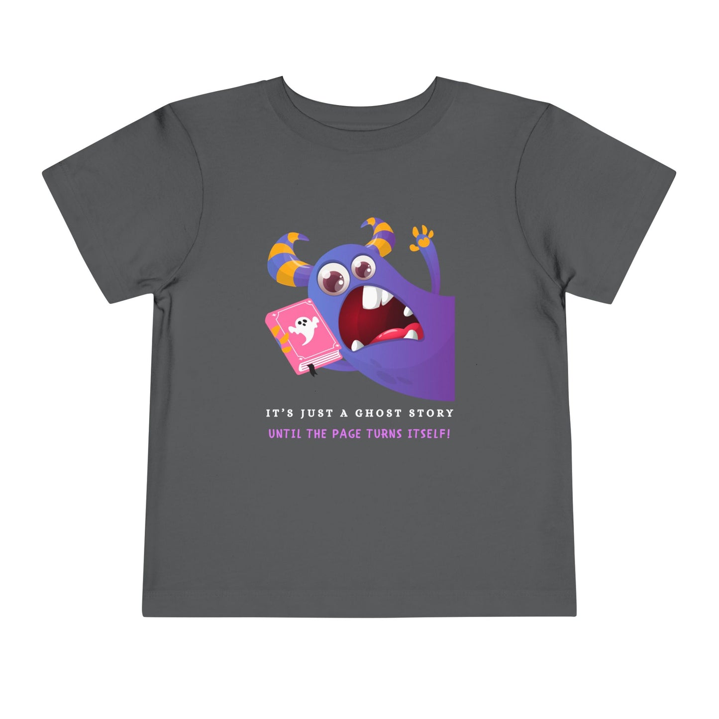 Gray toddler t-shirt with a scared purple monster holding a pink ghost book and text 'It's just a ghost story until the page turns itself!'