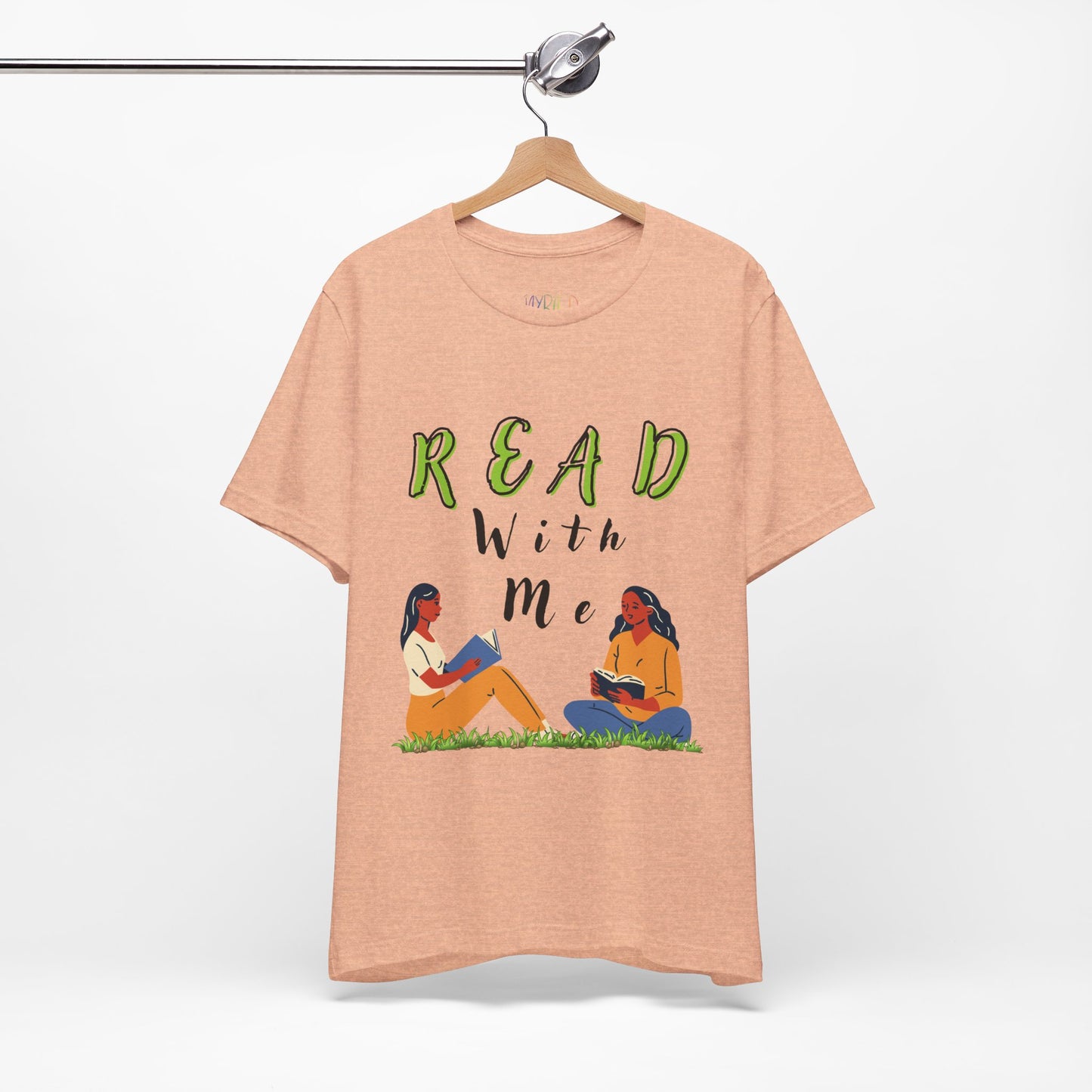 Peach t-shirt with 'Read With Me' text and illustrations of two people reading 