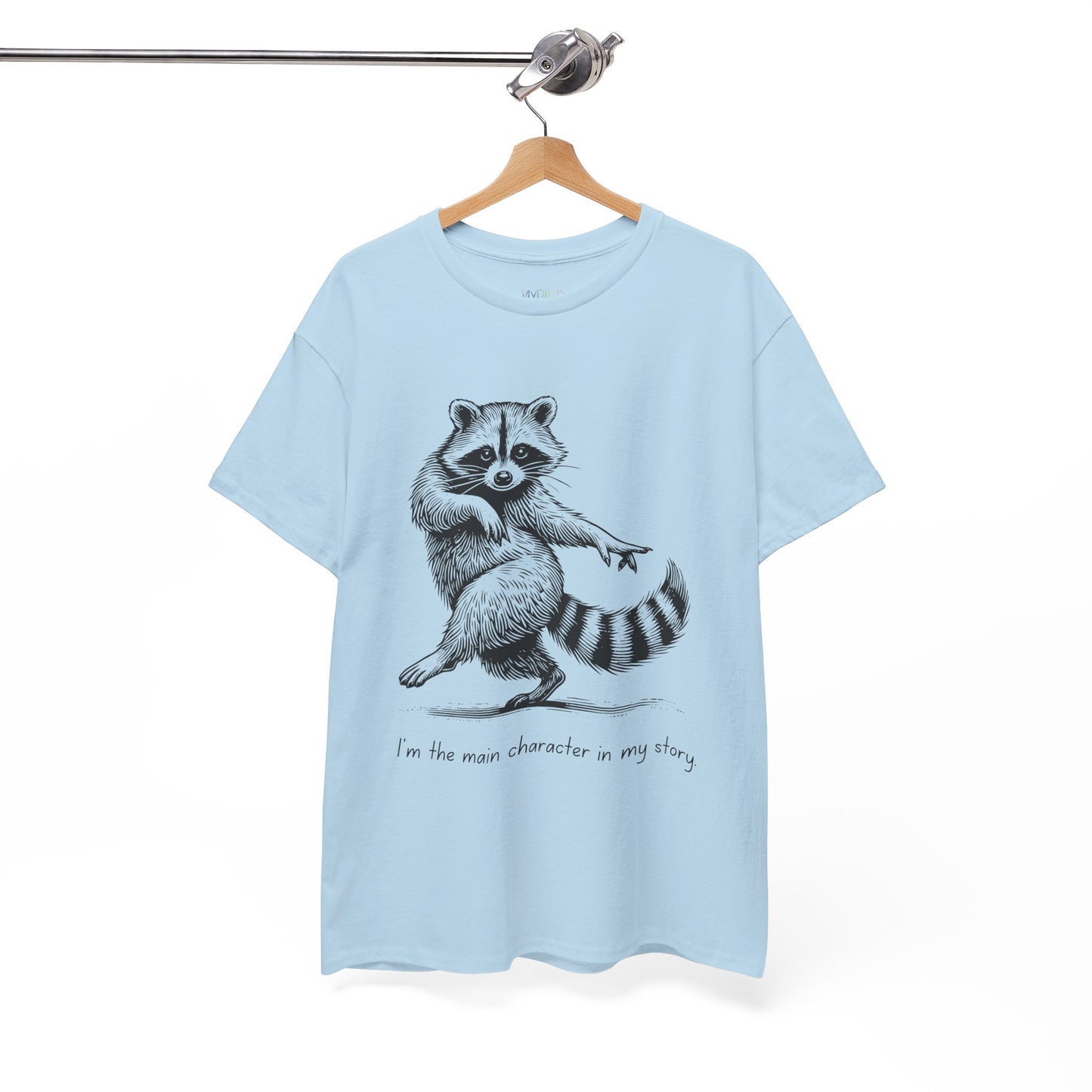 Light blue t-shirt with a dancing raccoon graphic and text 'I'm the main character in my story'