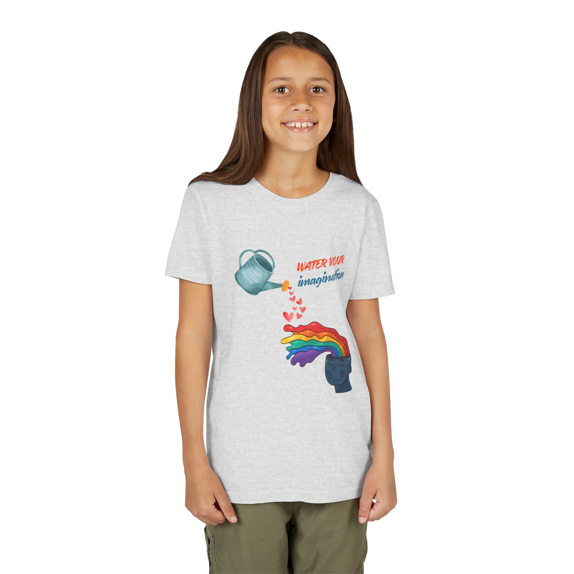 Girl wearing a light gray t-shirt with watering can pouring hearts into a watercolor rainbow brain with text 'Water your imagination' 