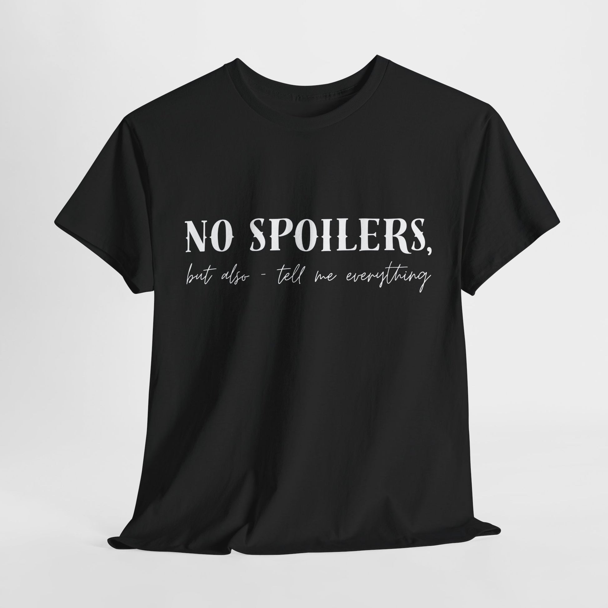 Black t-shirt with white text 'NO SPOILERS, but also - tell me everything'