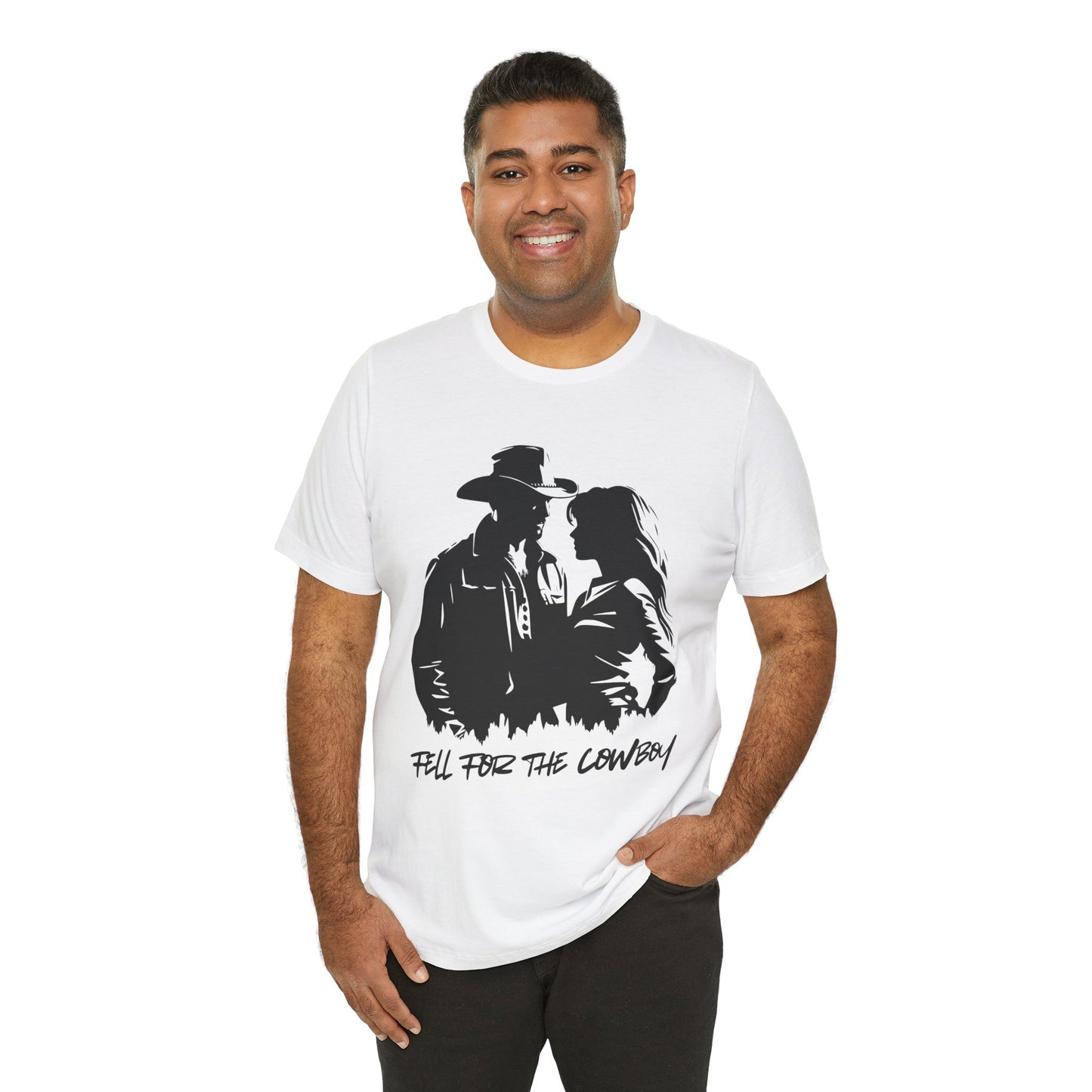 Man wearing a white t-shirt with black graphic of a man and a woman, text says 'Fell for the Cowboy'