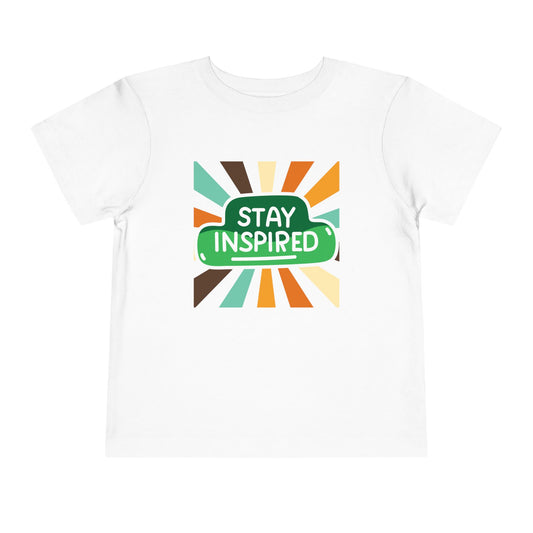 White t-shirt with 'Stay Inspired' graphic design with fun retro stripes
