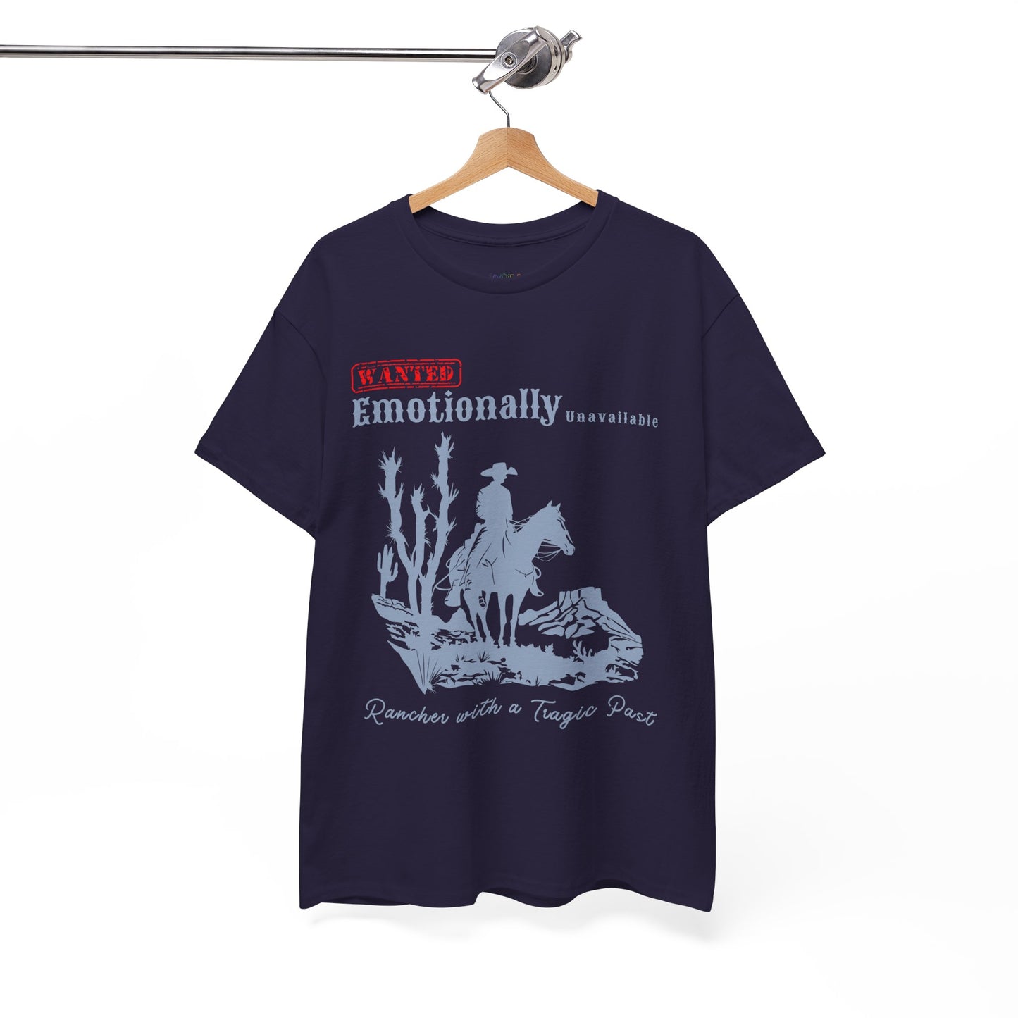 Dark blue t-shirt with a horse riding cowboy in a desert setting and text 'WANTED Emotionally Unavailable Rancher With A Tragic Past'