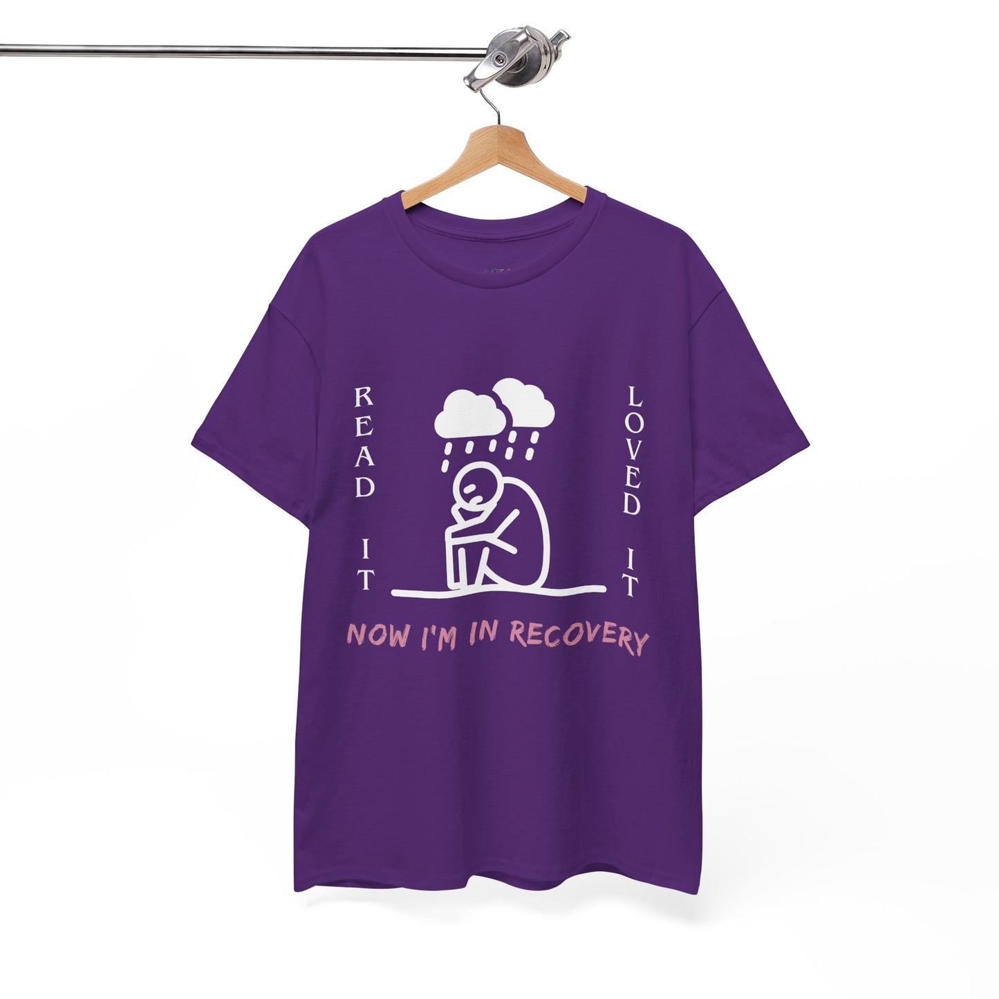 Purple t-shirt with a white graphic of a sad stick figure sitting under a cloud and text 'Read It. Loved It. Now I'm In Recovery.' 