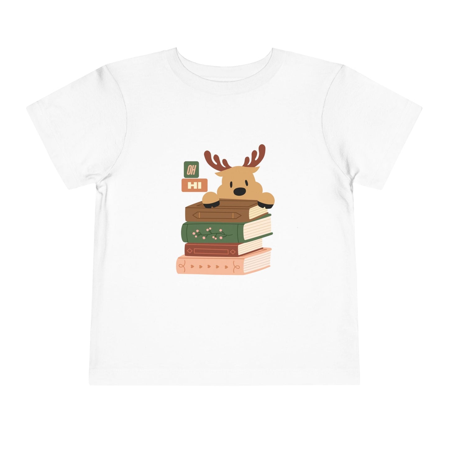 White toddler t-shirt with a cartoon reindeer peeking over a stack of books, text 'oh hi', on a white background
