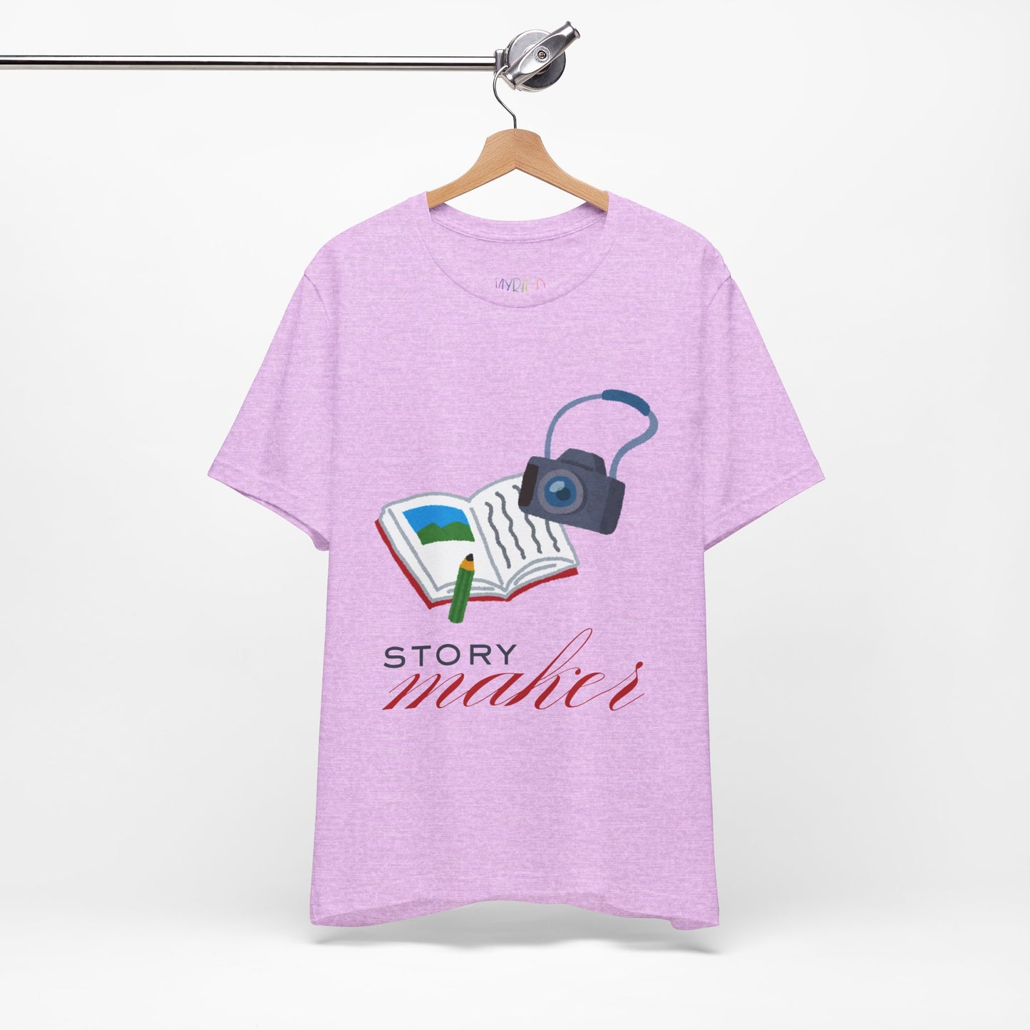 Light purple t-shirt with an open book, pencil and camera, 'Story Maker' text beneath