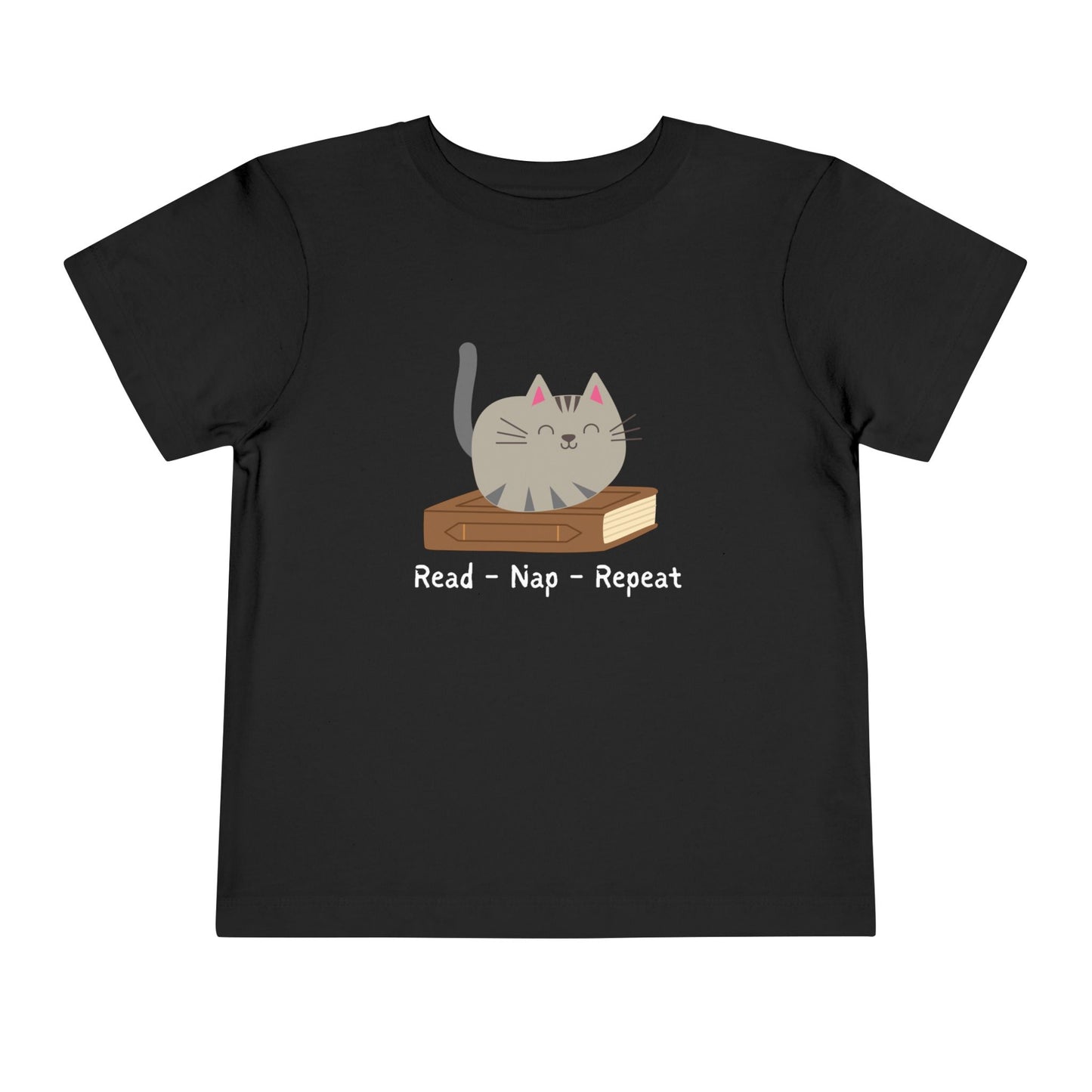 Black t-shirt with a cat sitting on a book with text 'Read - Nap - Repeat' 