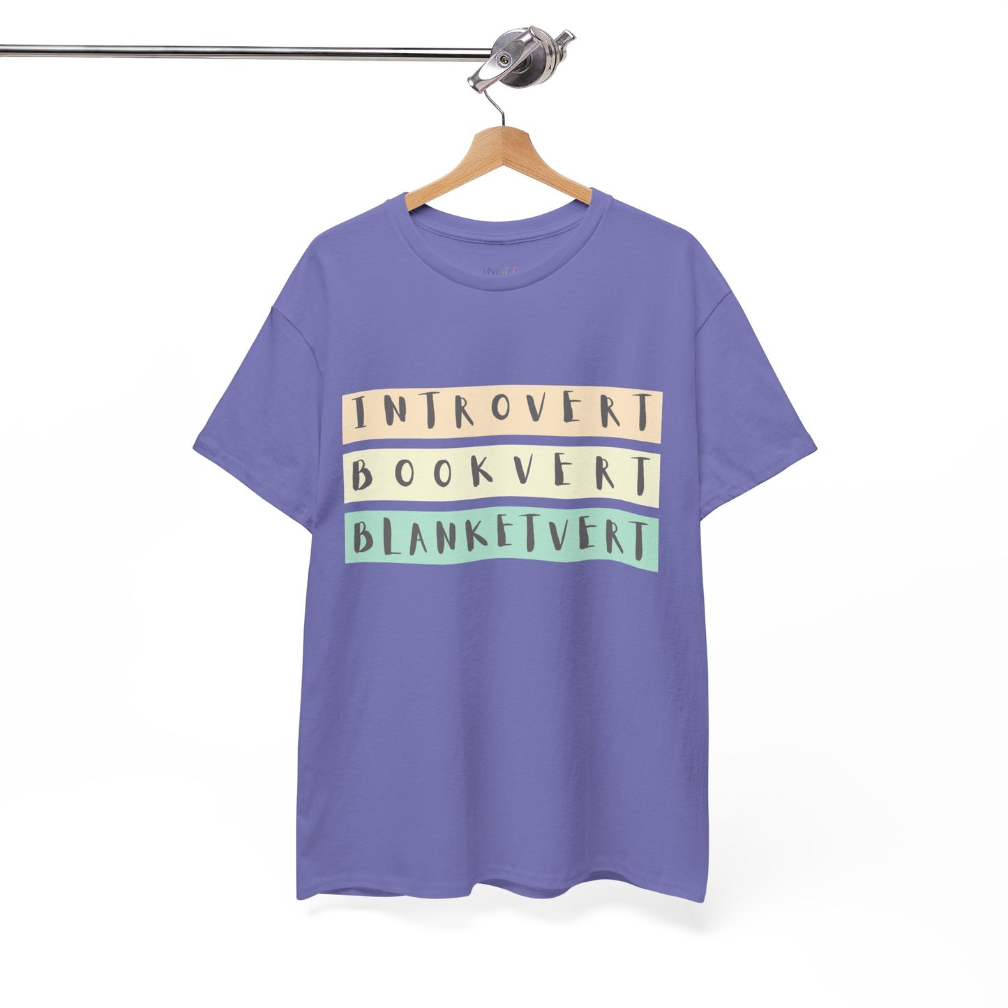 Lilac t-shirt with soft colorful text 'Introvert. Bookvert. Blanketvert.'