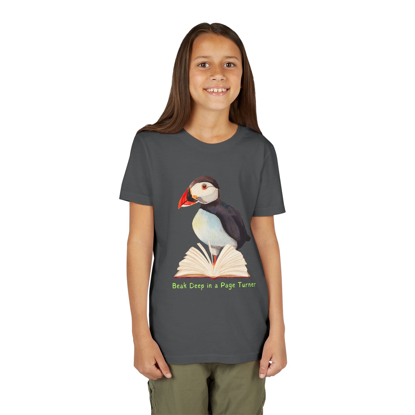 Girl wearing a dark gray t-shirt with a puffin, open book and text 'Beak Deep in a Page Turn' 