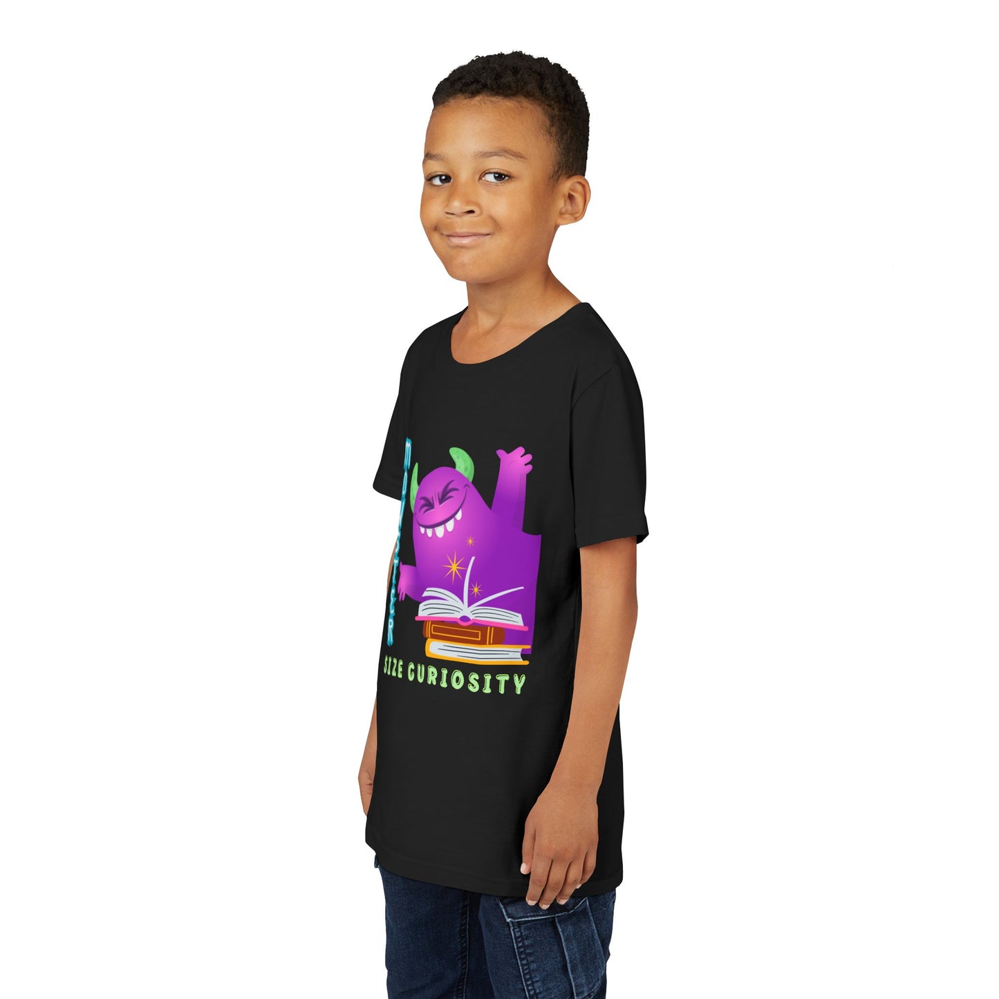 Boy wearing a black t-shirt with a purple monster leaning in from the edge of the page, a stack of books and text 'Monster Size Curiosity' 