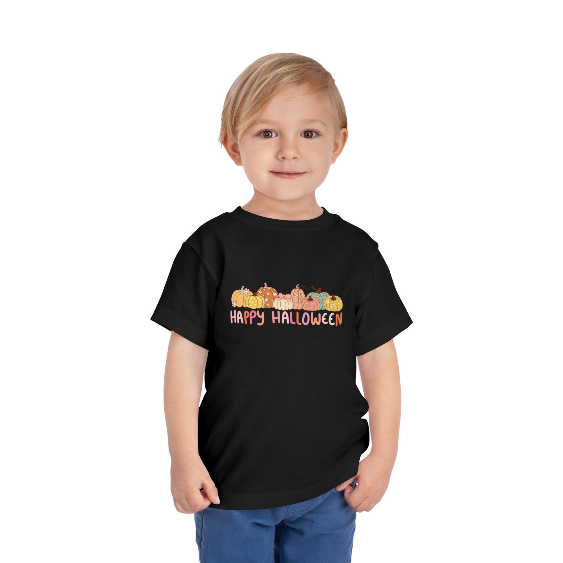 Child wearing a black t-shirt with 'Happy Halloween' and pumpkin design on a white background