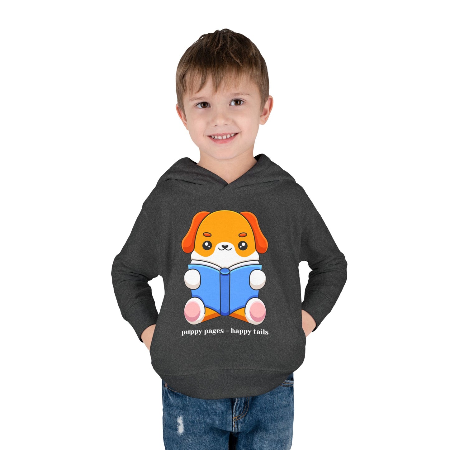 boy wearing a dark gray toddler hoodie with a cartoon dog reading a book and text 'puppy pages - happy tails'