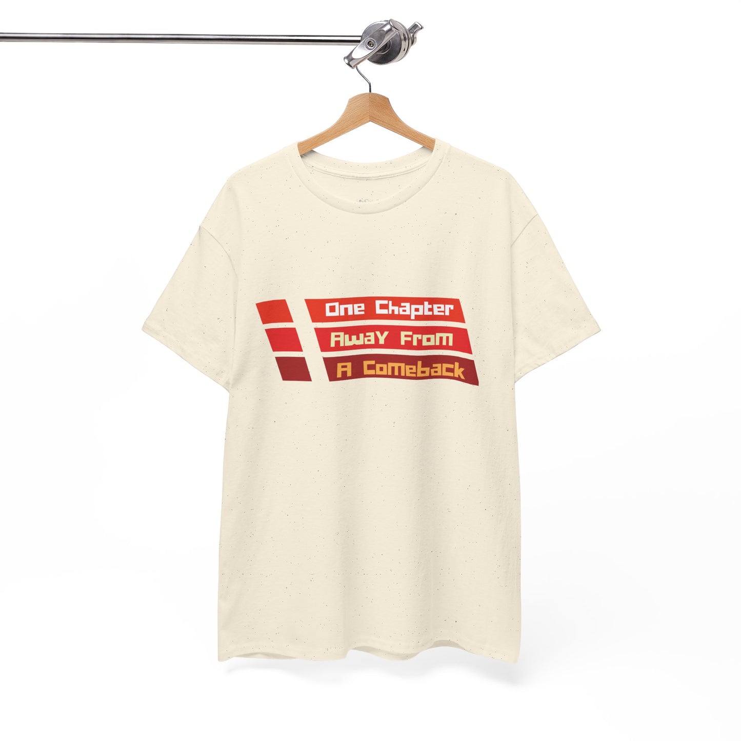 Beige t-shirt with red lines and text in each 'One Chapter Away From A Comeback'
